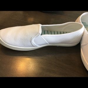 White slip on boat shoes